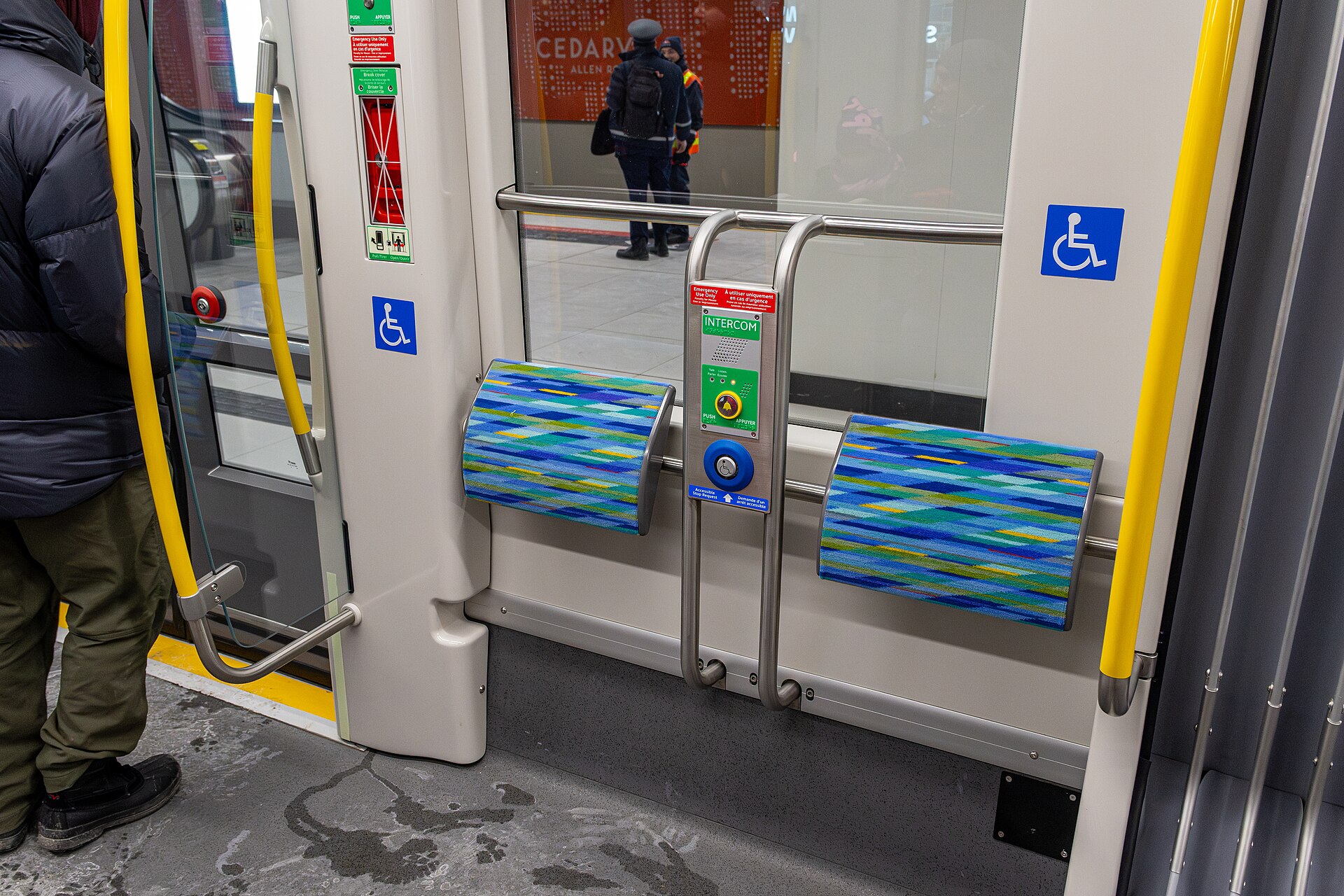A Chicago 'L' train car interior demonstrates accessibility features for public transportation and station platforms.