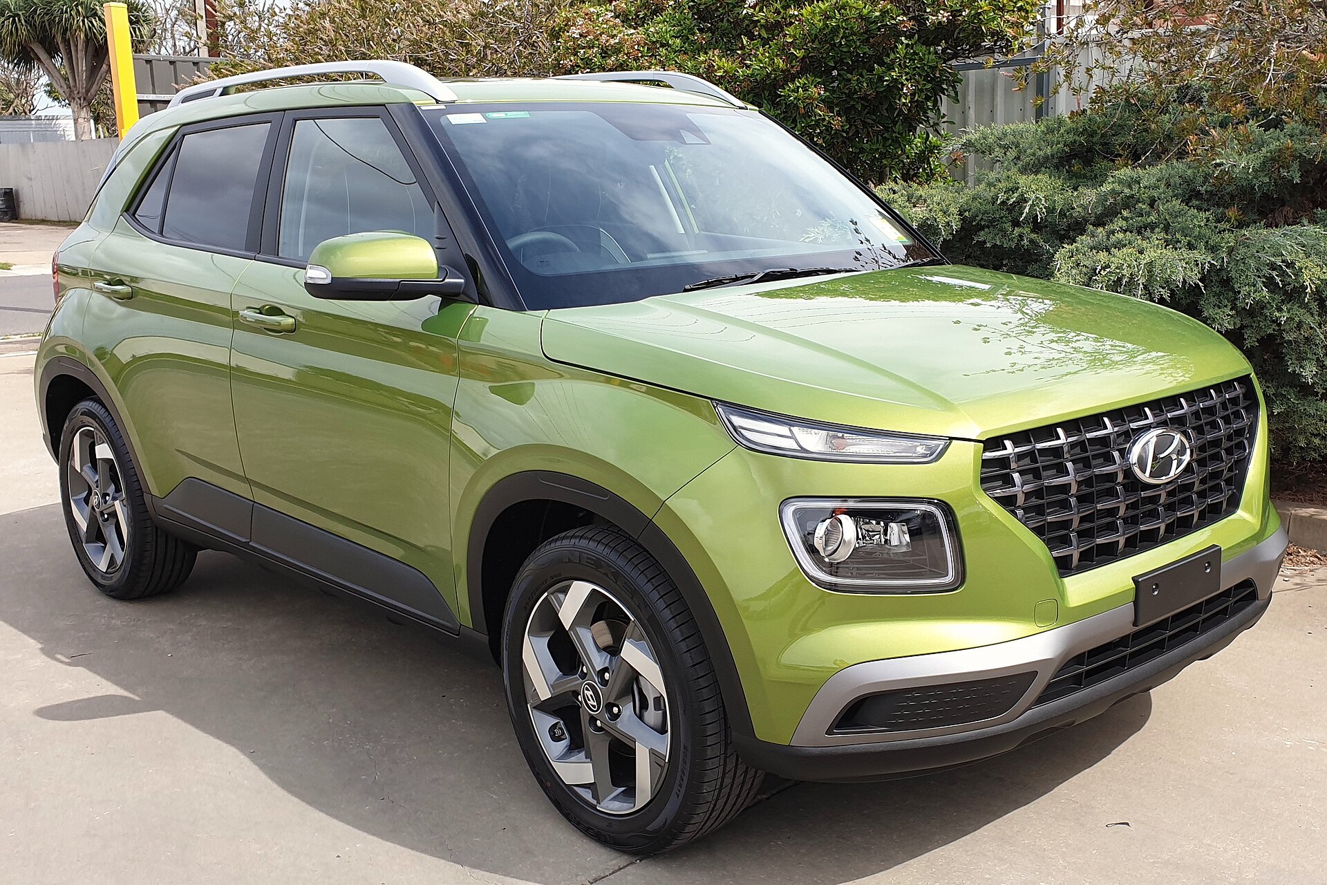 A green Hyundai Venue is pictured, a practical vehicle for getting to events.